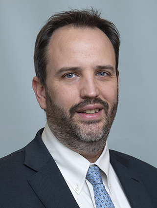 Dr. Justin Gainor